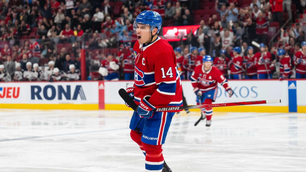 Montreal Canadiens captain Nick Suzuki celebrates after scoring a goal during a home game at the Bell Centre